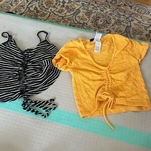 Two once worn shirts, good condition